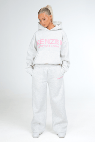 Person wearing a white hoodie and pants with 'KENZEN' branding on a white background