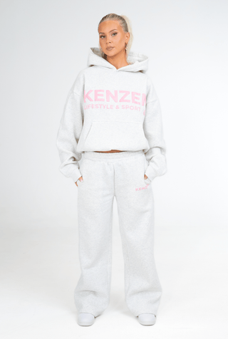 Person wearing a white hoodie and pants with 'KENZEN' branding on a white background